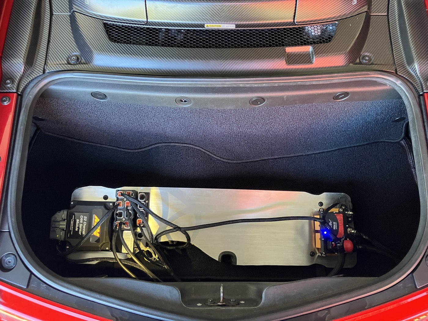 Custom data-logging electronics and wiring installed inside the NSX trunk